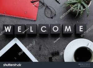 stock photo flat lay composition of black cubes with word welcome on grey table 2171901539